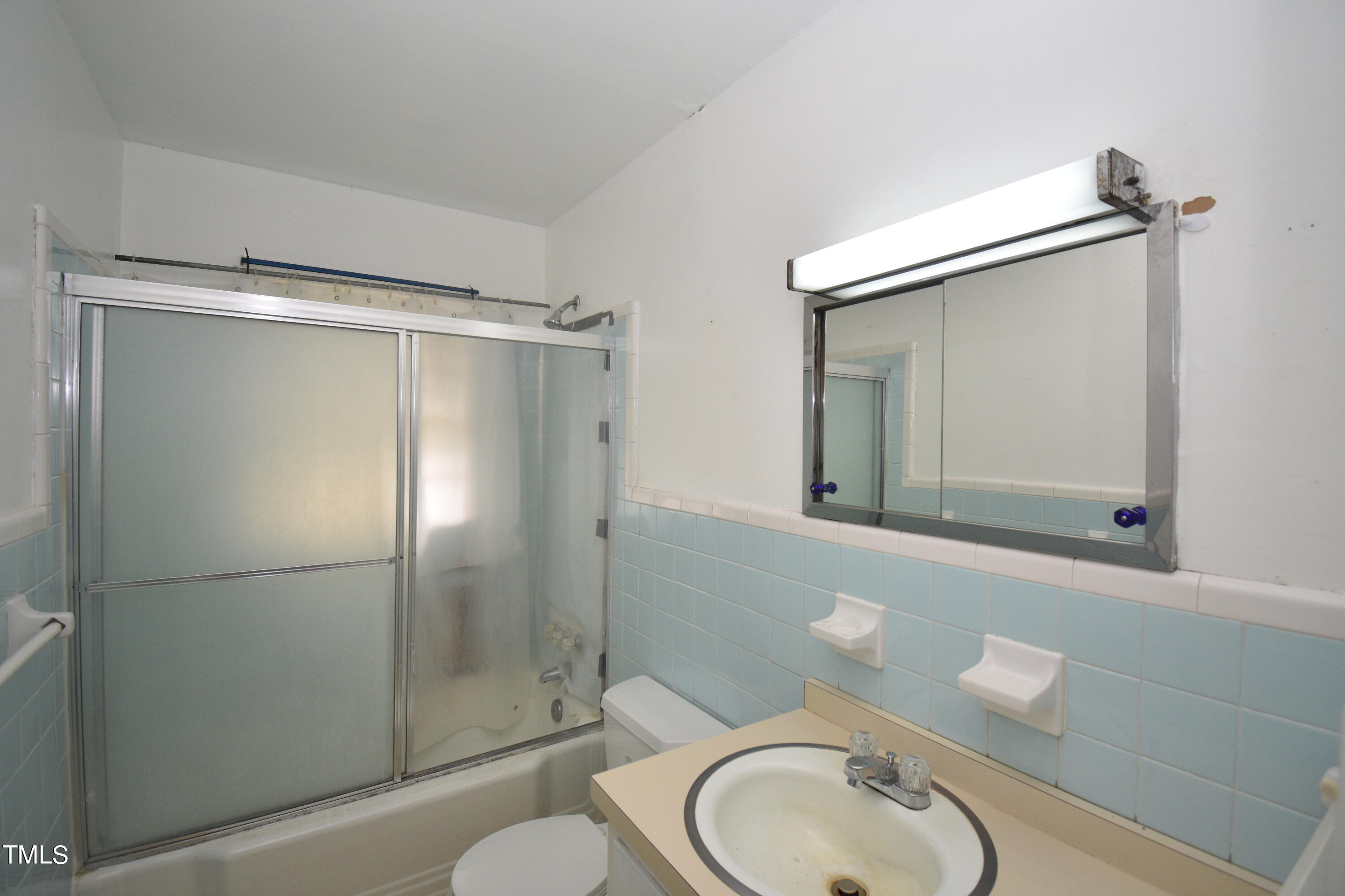 6115 Lake Wheeler Road Raleigh, NC 27603 - Photo 11 of 22 a bathroom with a granite countertop toilet sink and shower
