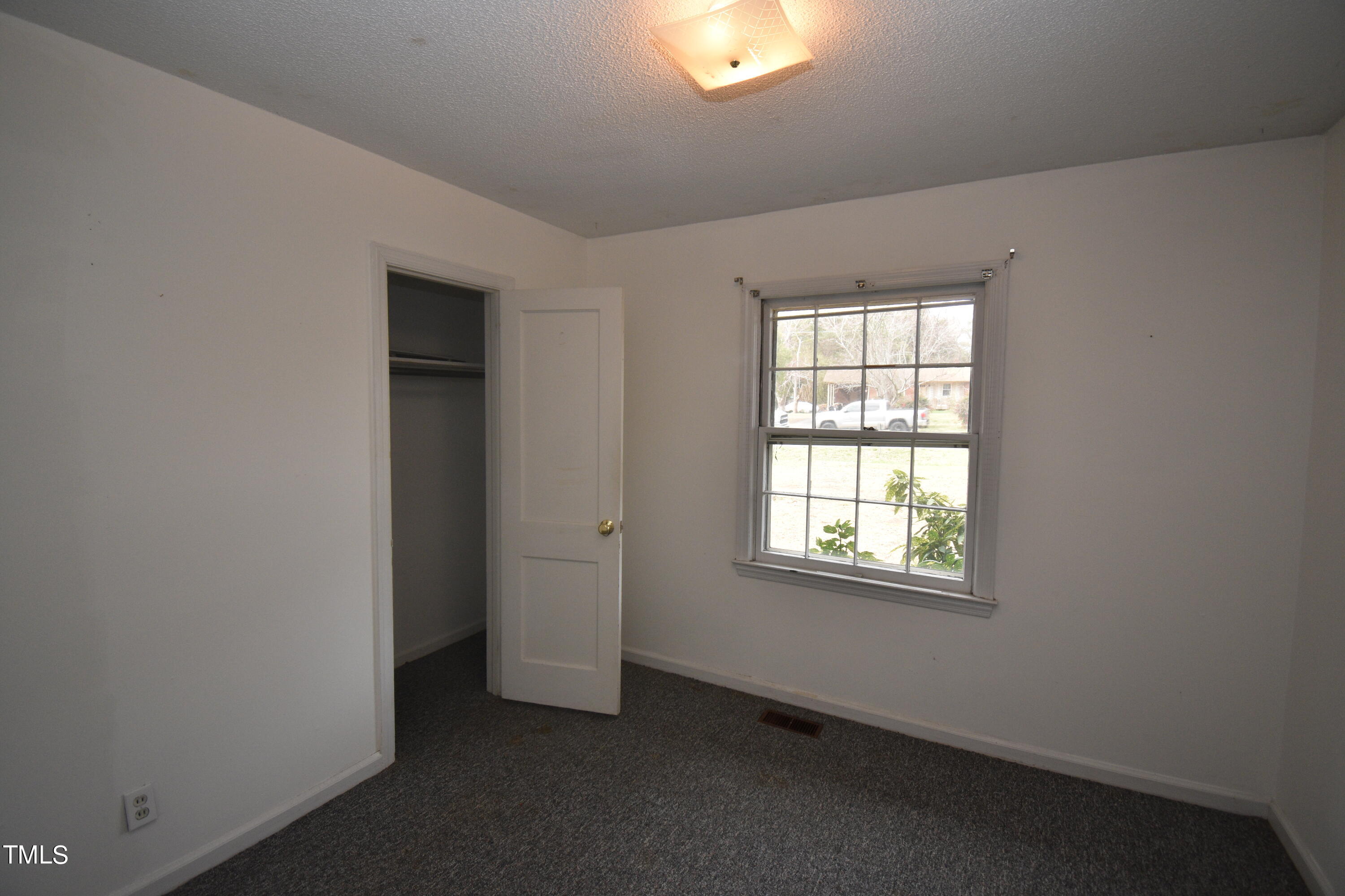 6115 Lake Wheeler Road Raleigh, NC 27603 - Photo 13 of 22 an empty room with a window