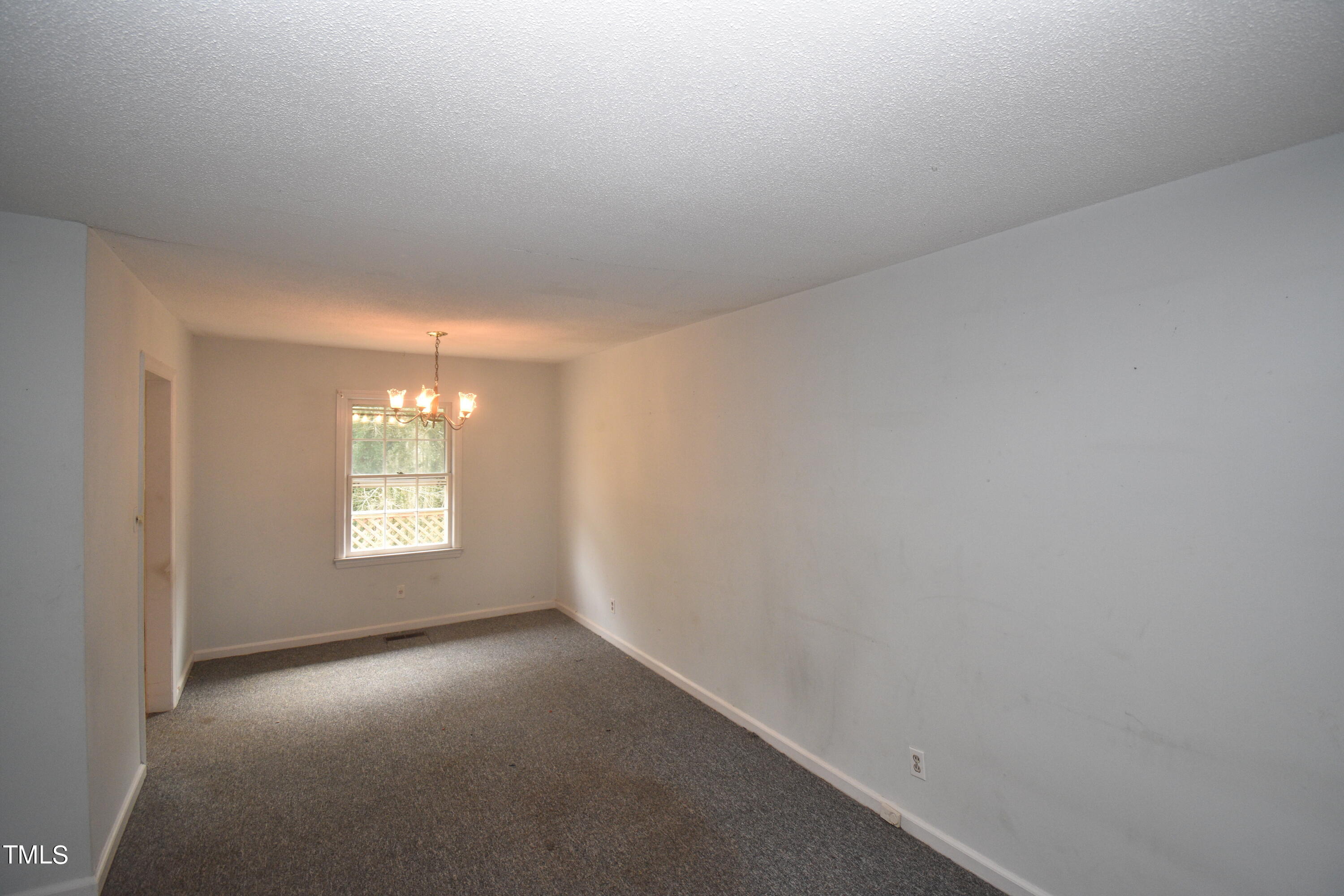 6115 Lake Wheeler Road Raleigh, NC 27603 - Photo 6 of 22 a view of empty room with windows