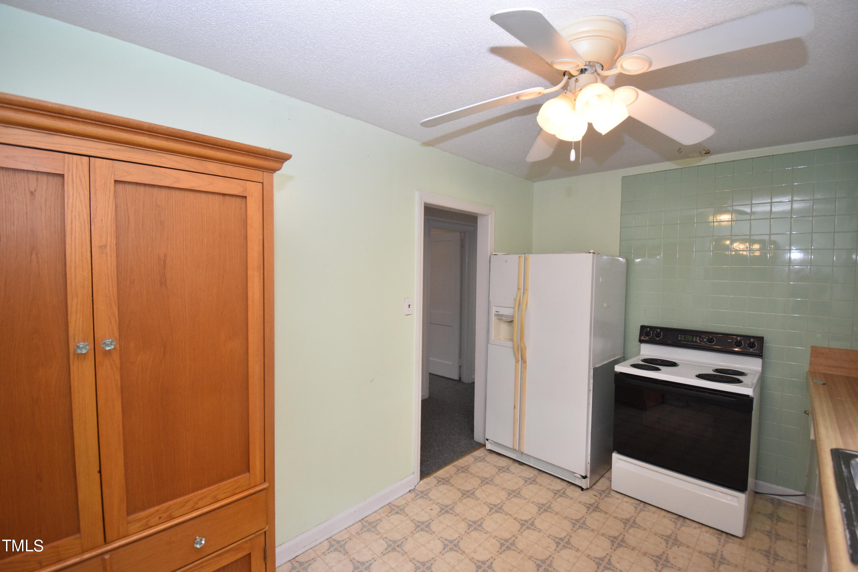 6115 Lake Wheeler Road Raleigh, NC 27603 - Photo 7 of 22 a view of a refrigerator in kitchen and utility room