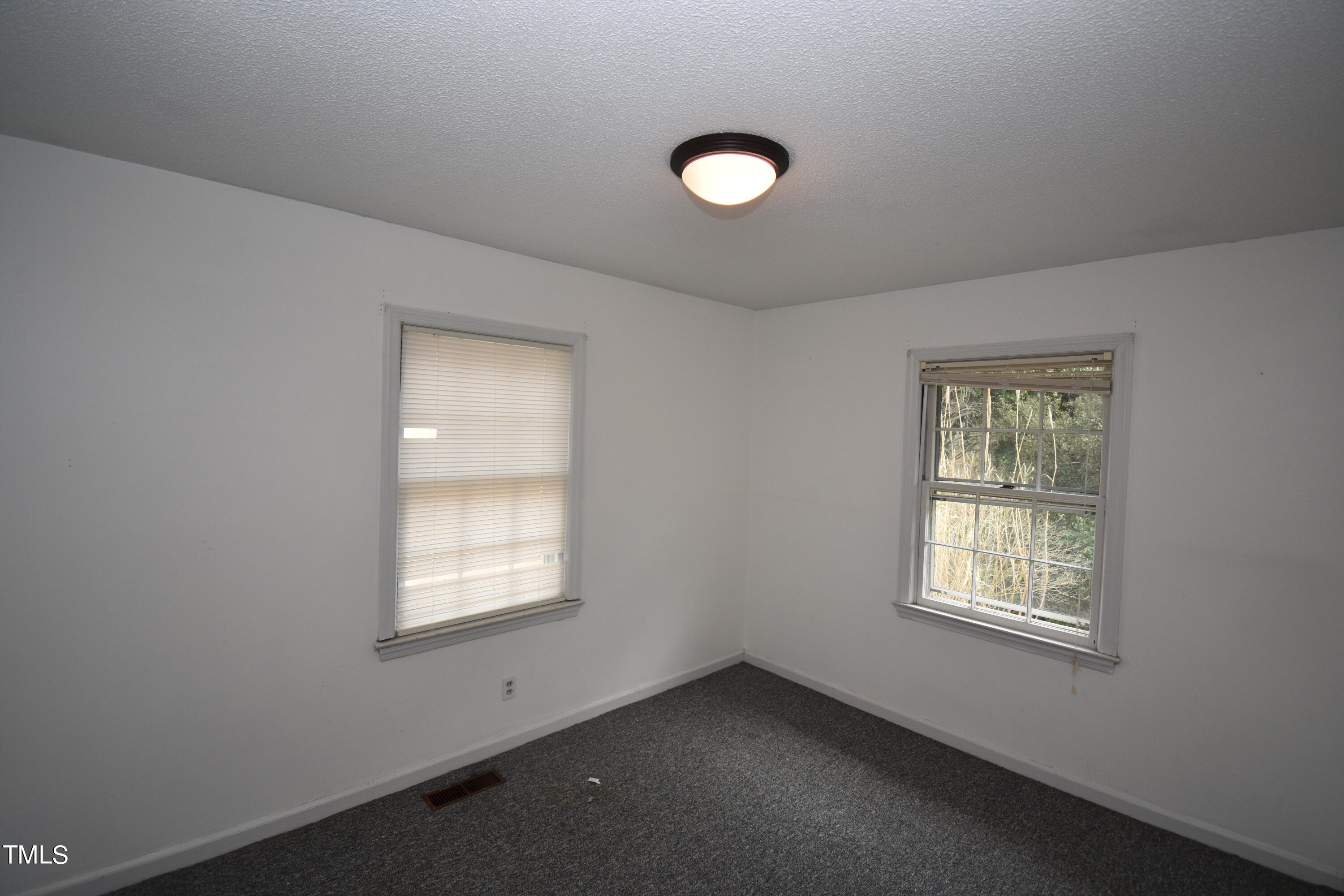 6115 Lake Wheeler Road Raleigh, NC 27603 - Photo 10 of 22 an empty room with a window