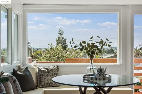 a view of a dining room with furniture window and outside view