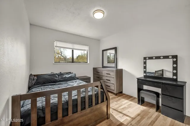 a bedroom with furniture and a window