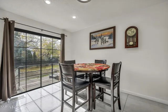 a view of a dining room with furniture and a table