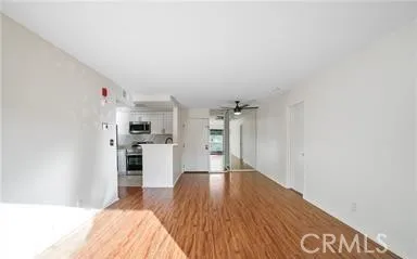 a very nice looking room with a large bed and wooden floor