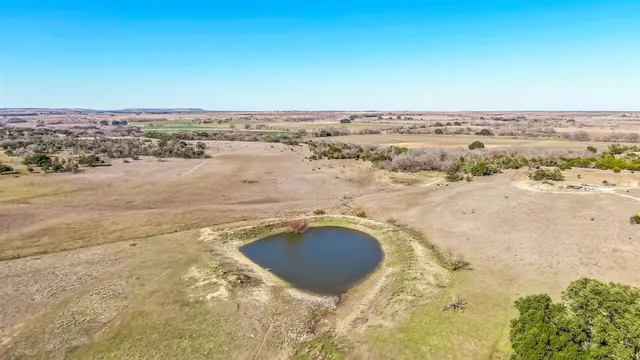 a view of a field with an outdoor space