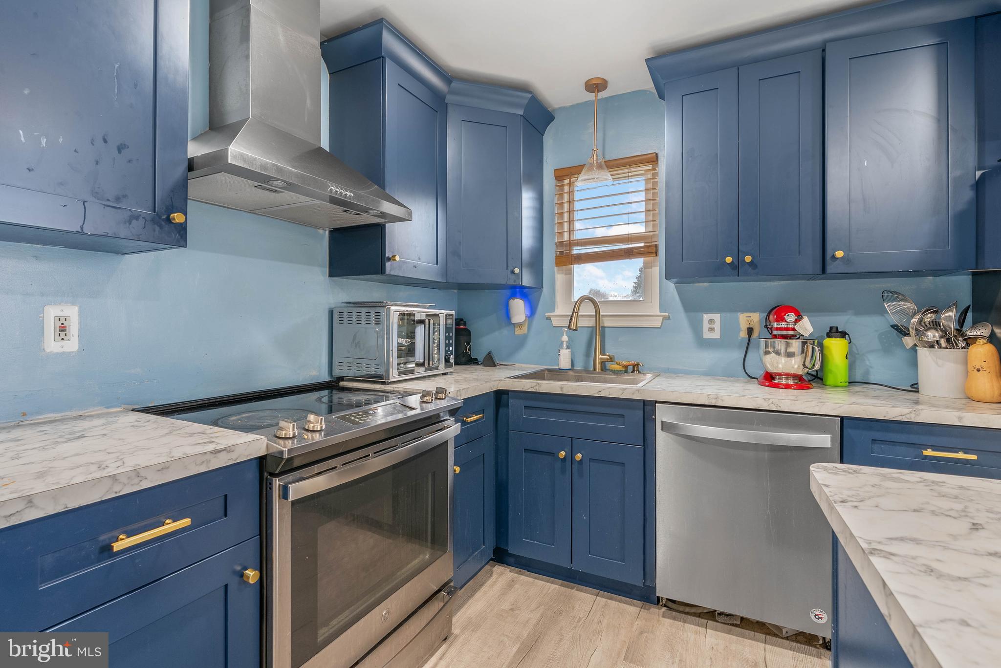 1012 Franklin Avenue Croydon, PA 19021 - Photo 10 of 25 a kitchen with stainless steel appliances granite countertop a sink stove and cabinets