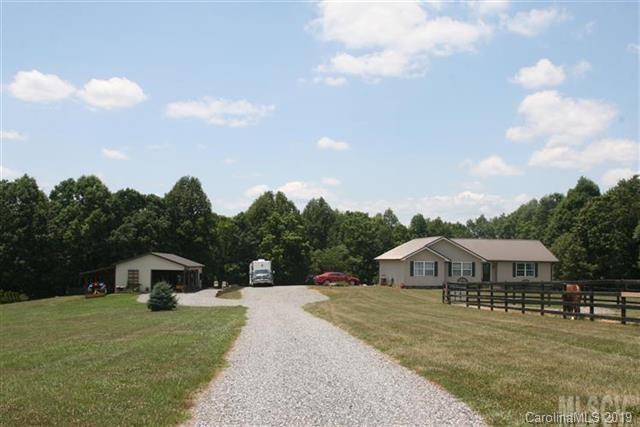 1949 Cheatham Ford Road Hiddenite, NC 28636 - Photo 4 of 4 a view of a town with barn house in the background