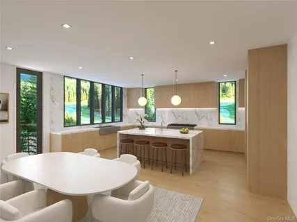 a kitchen with a stove a sink a dining table and chairs