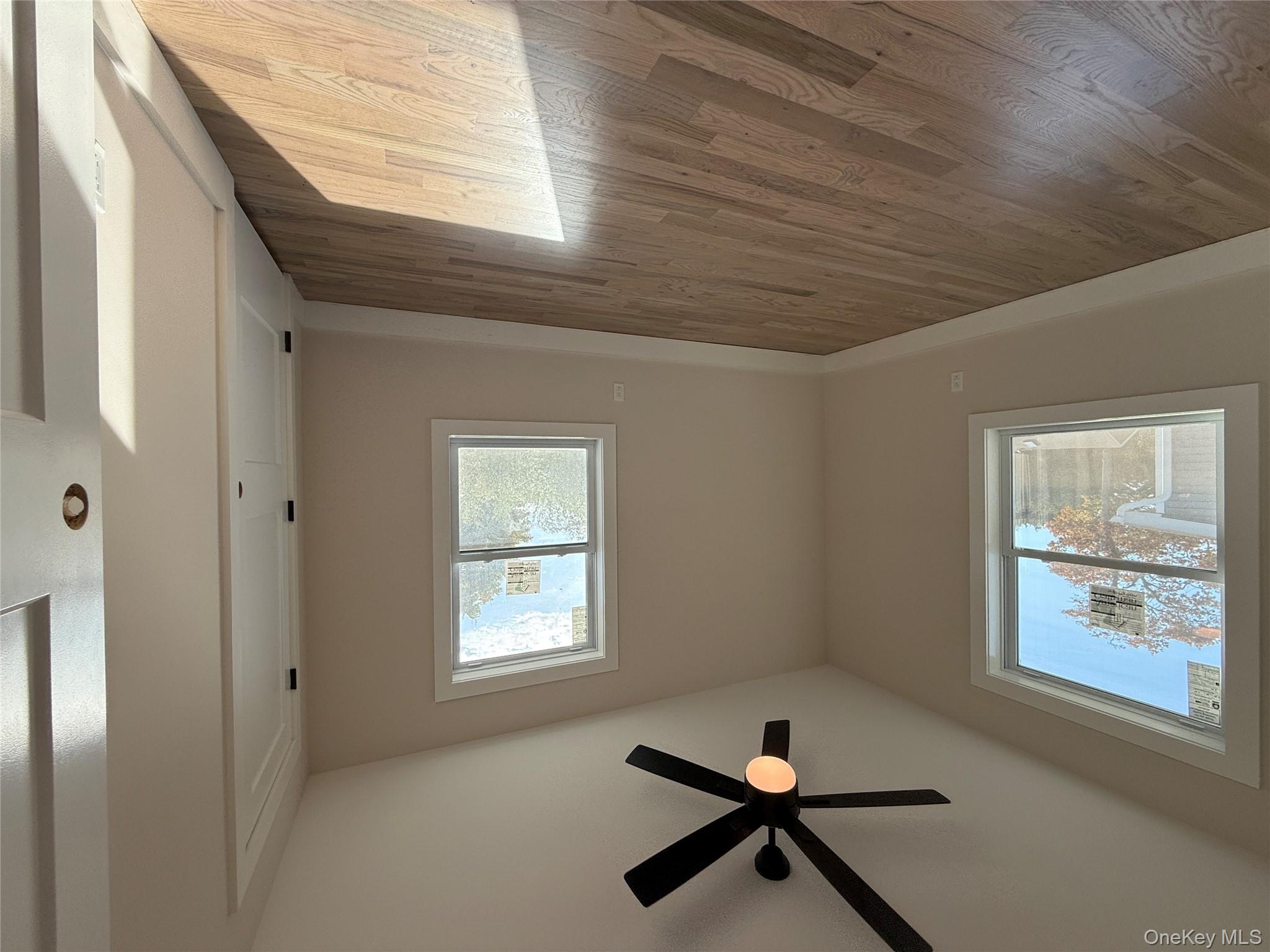 New Construction Rugby Drive Shirley, NY 11967 - Photo 12 of 17 a view of empty room with wooden floor and fan