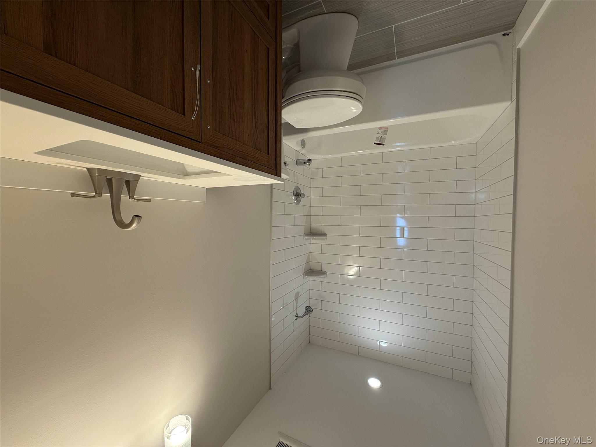 New Construction Rugby Drive Shirley, NY 11967 - Photo 14 of 17 a bathroom with a sink toilet and shower