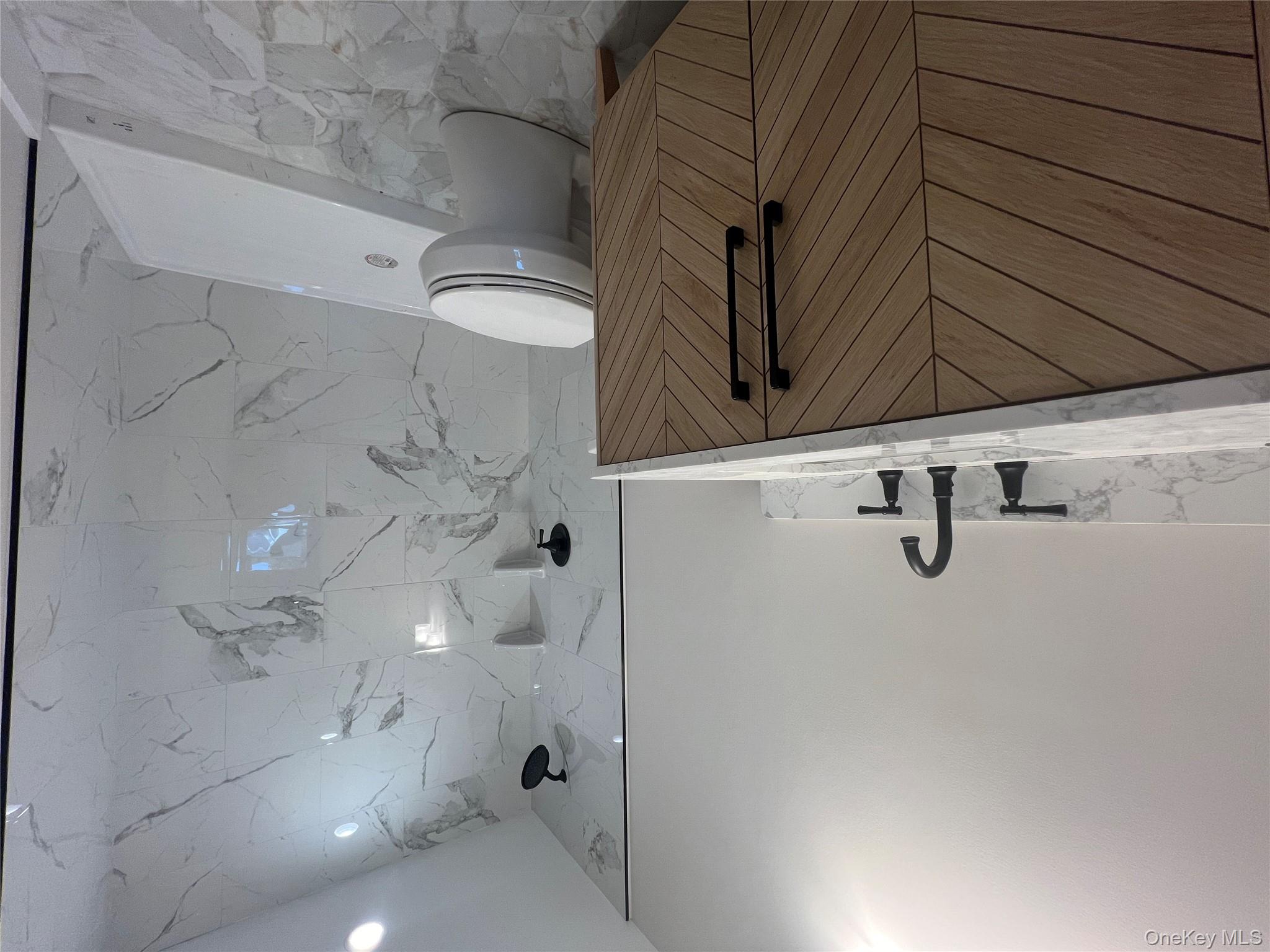 New Construction Rugby Drive Shirley, NY 11967 - Photo 8 of 17 a bathroom with a sink a toilet and shower