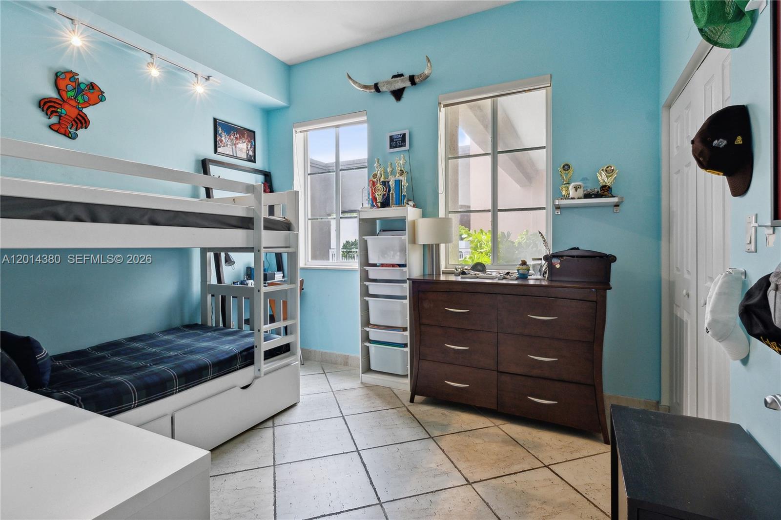 100 Meridian Avenue, Unit 244 Miami Beach, FL 33139 - Photo 12 of 18 a bed room with a bed and a window