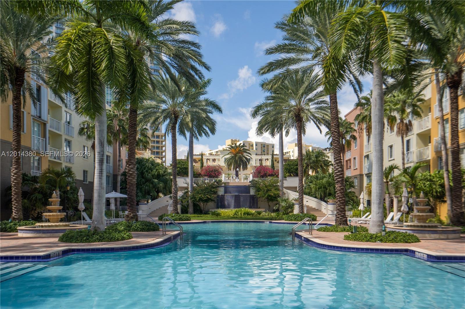 100 Meridian Avenue, Unit 244 Miami Beach, FL 33139 - Photo 16 of 18 a view of a swimming pool with a table and chairs