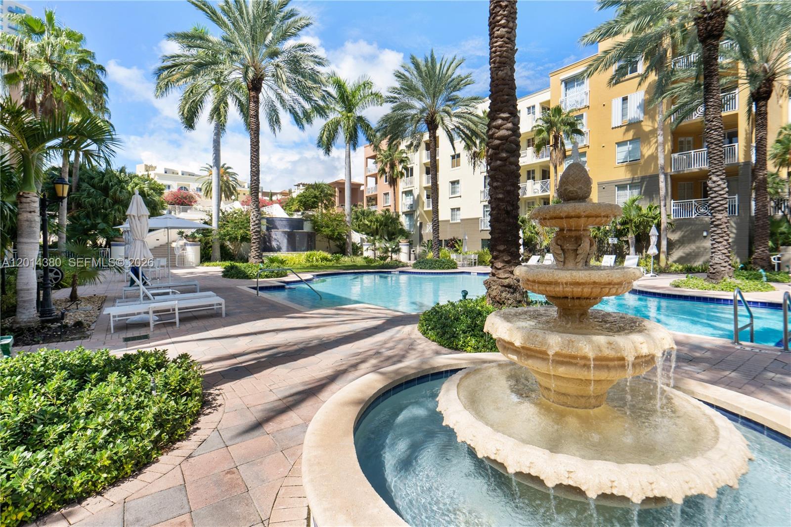 100 Meridian Avenue, Unit 244 Miami Beach, FL 33139 - Photo 17 of 18 a swimming pool with outdoor seating and yard