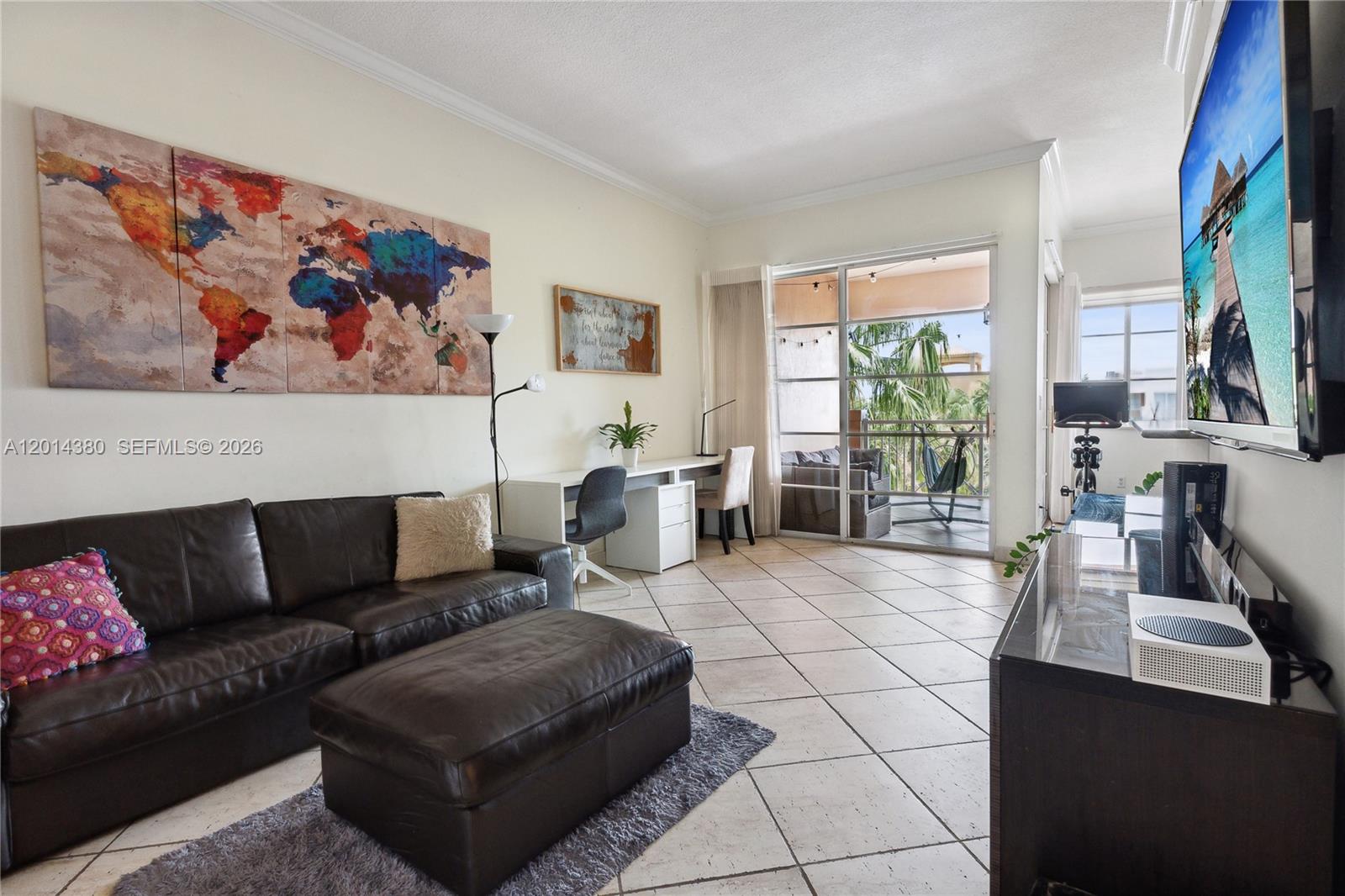 100 Meridian Avenue, Unit 244 Miami Beach, FL 33139 - Photo 4 of 18 a living room with furniture and a painting on the wall