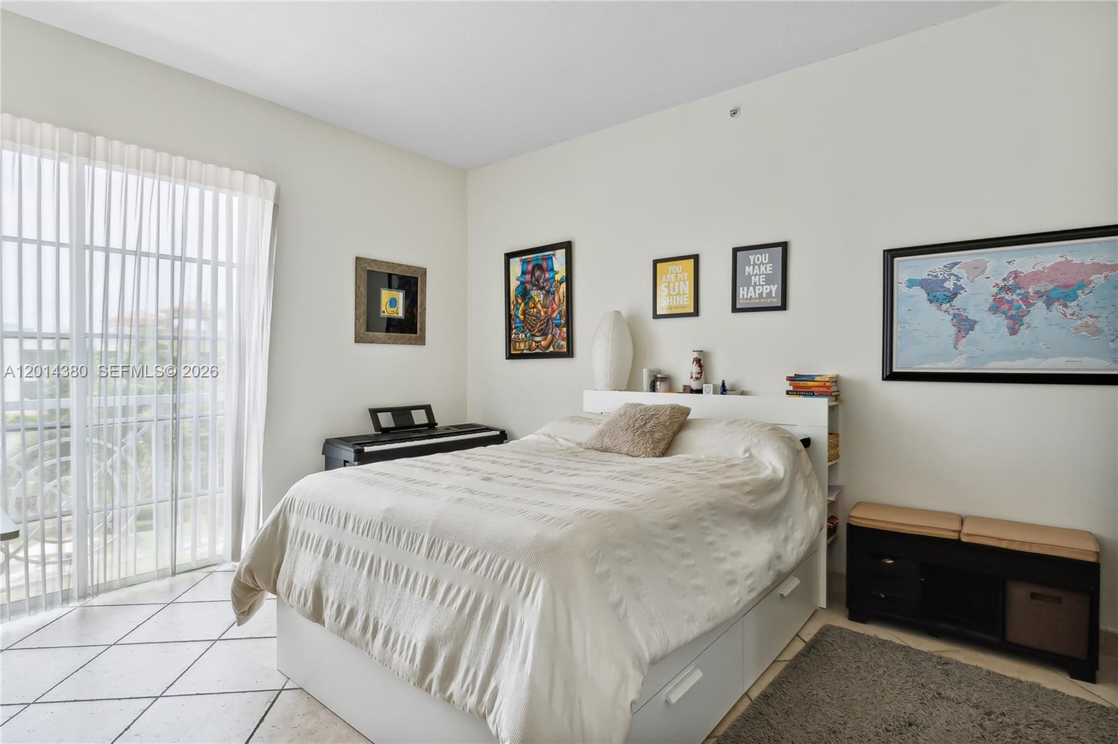 100 Meridian Avenue, Unit 244 Miami Beach, FL 33139 - Photo 8 of 18 a bedroom with a large bed and a window