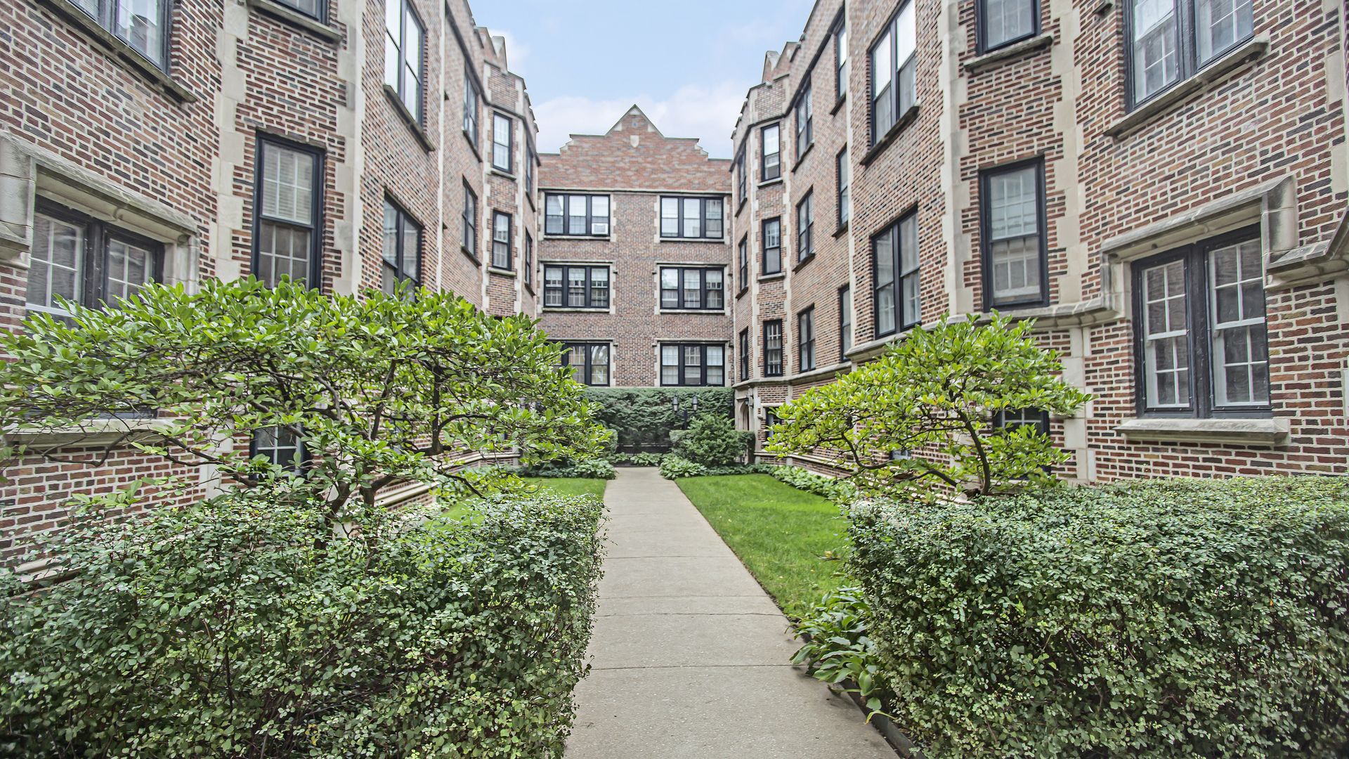 596 Sheridan Square, Unit 1 Evanston, IL 60202 - Photo 1 of 17 a view of a building with garden
