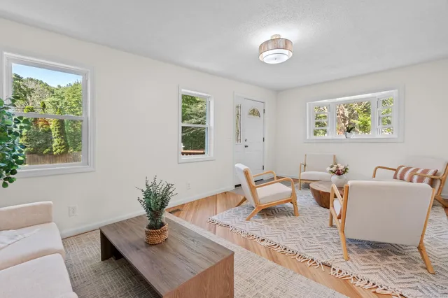 a living room with furniture and a window
