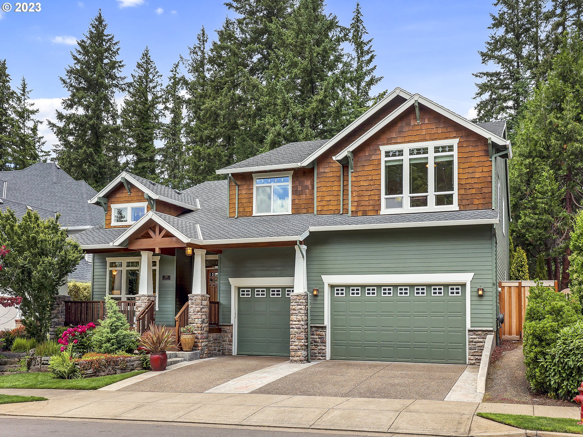 9965 Southwest Choctaw Street Tualatin, OR 97062 - Photo 1 of 25 a front view of a house with garden