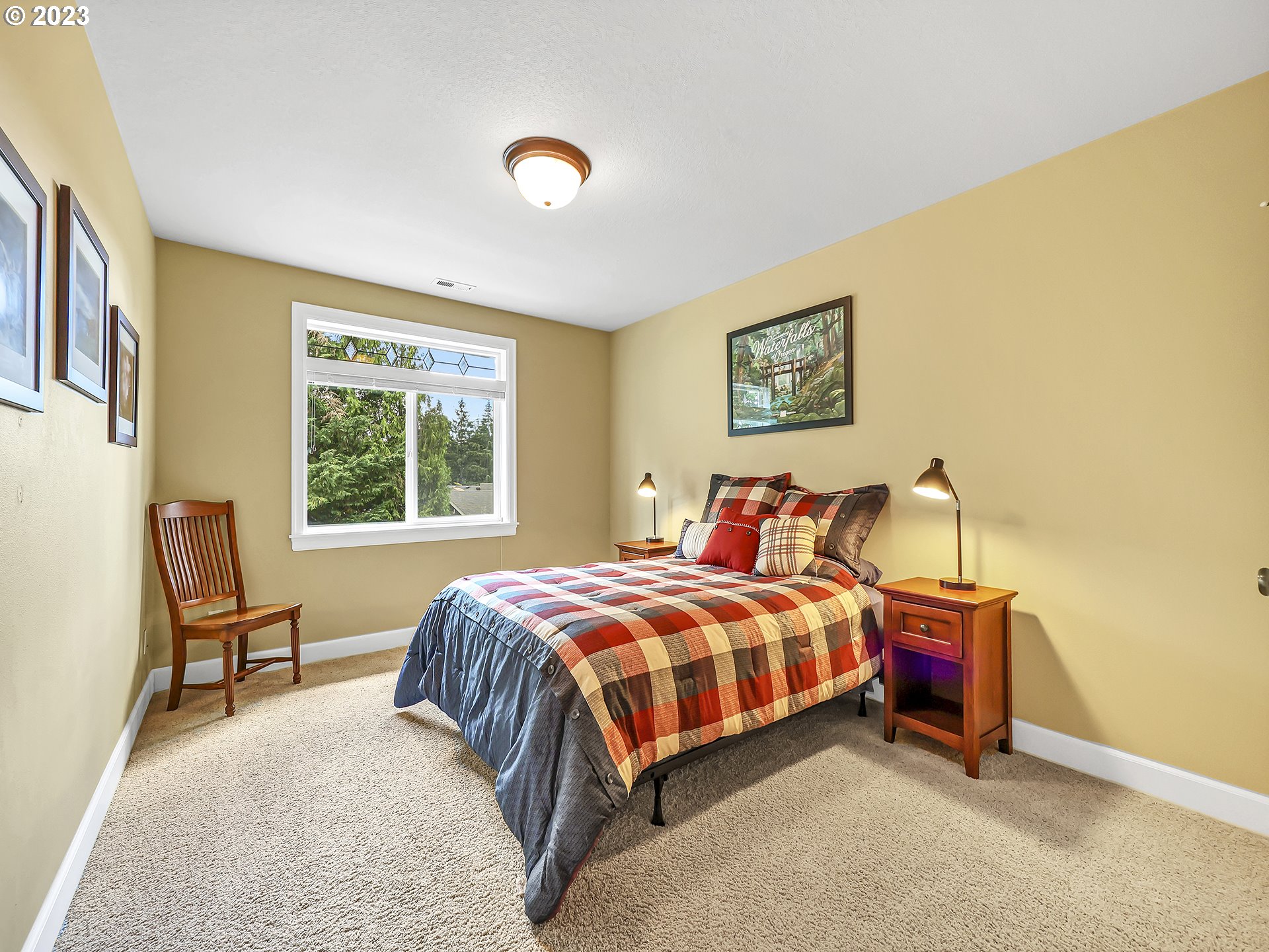 9965 Southwest Choctaw Street Tualatin, OR 97062 - Photo 20 of 25 a bed room with a bed and a chair