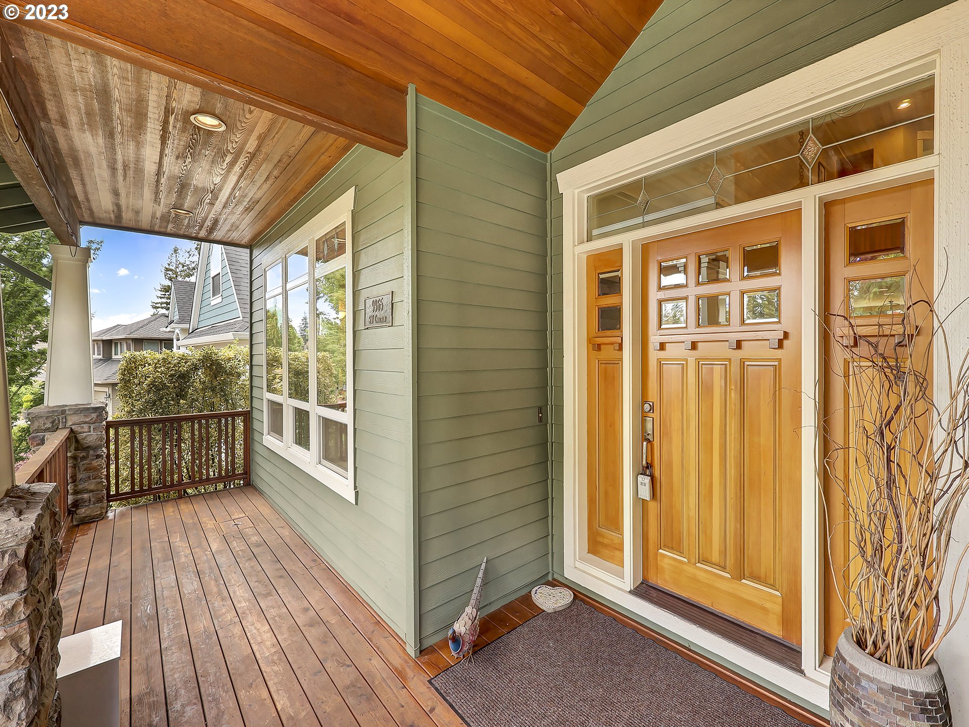 9965 Southwest Choctaw Street Tualatin, OR 97062 - Photo 2 of 25 a view of a balcony with wooden floor and door