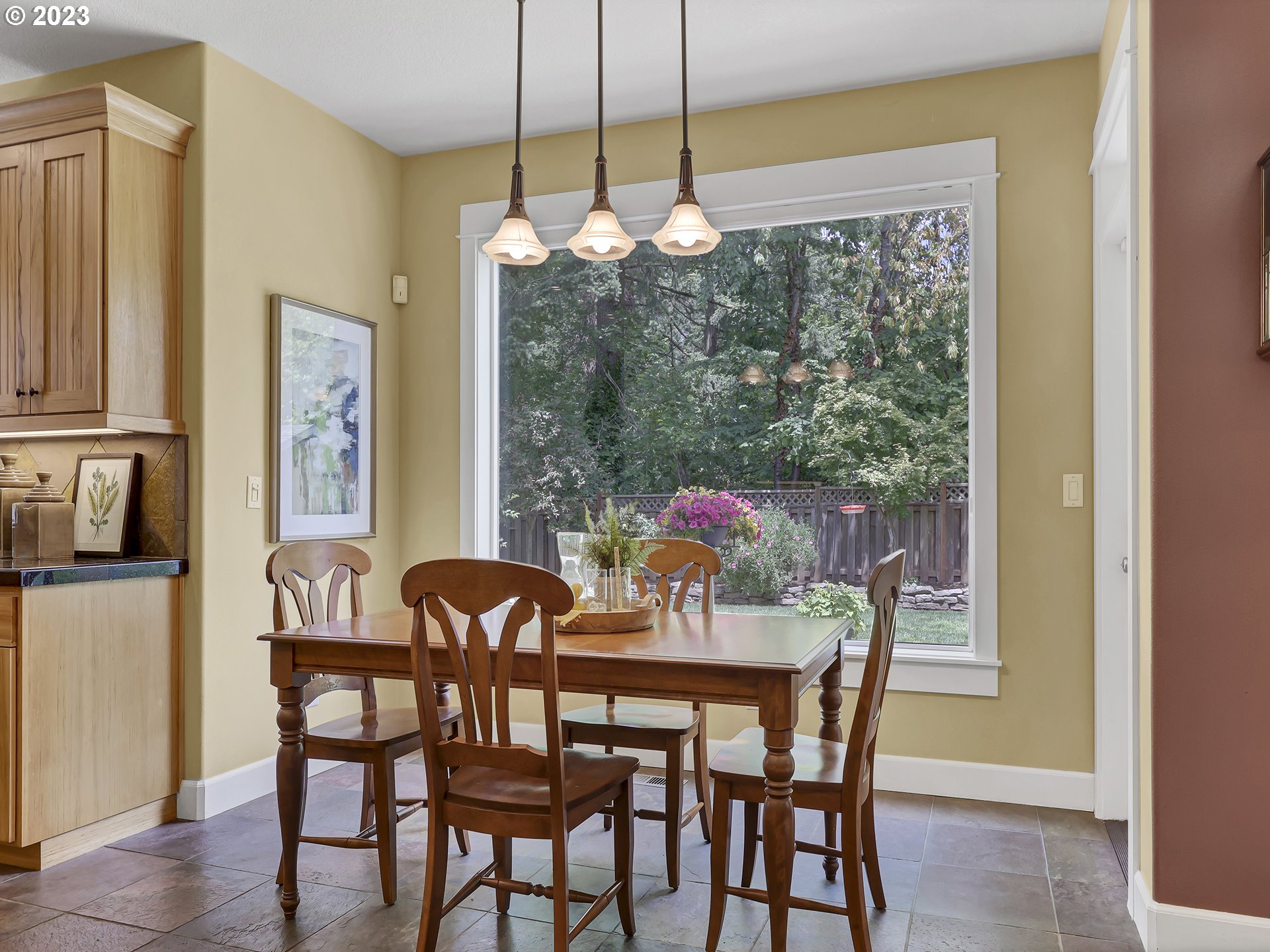 9965 Southwest Choctaw Street Tualatin, OR 97062 - Photo 8 of 25 a view of a dining room with furniture window and outside view