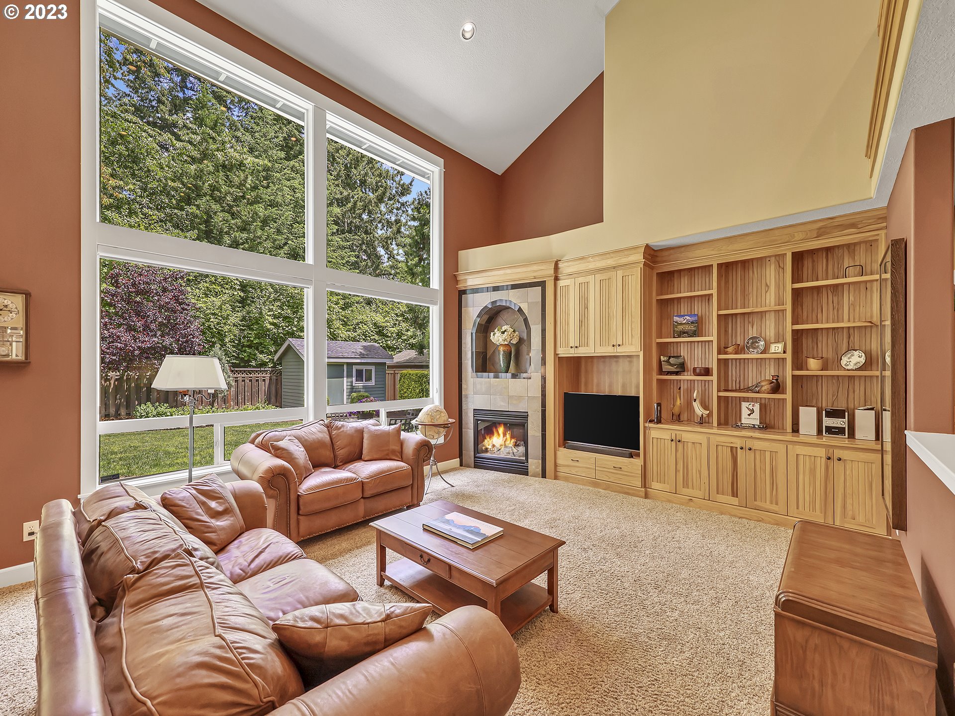 9965 Southwest Choctaw Street Tualatin, OR 97062 - Photo 9 of 25 a living room with furniture and a fireplace