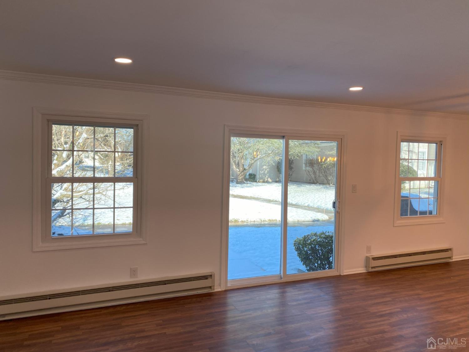 A Zacatin Road Freehold, NJ 07728 - Photo 11 of 25 a view of an empty room with wooden floor and a window