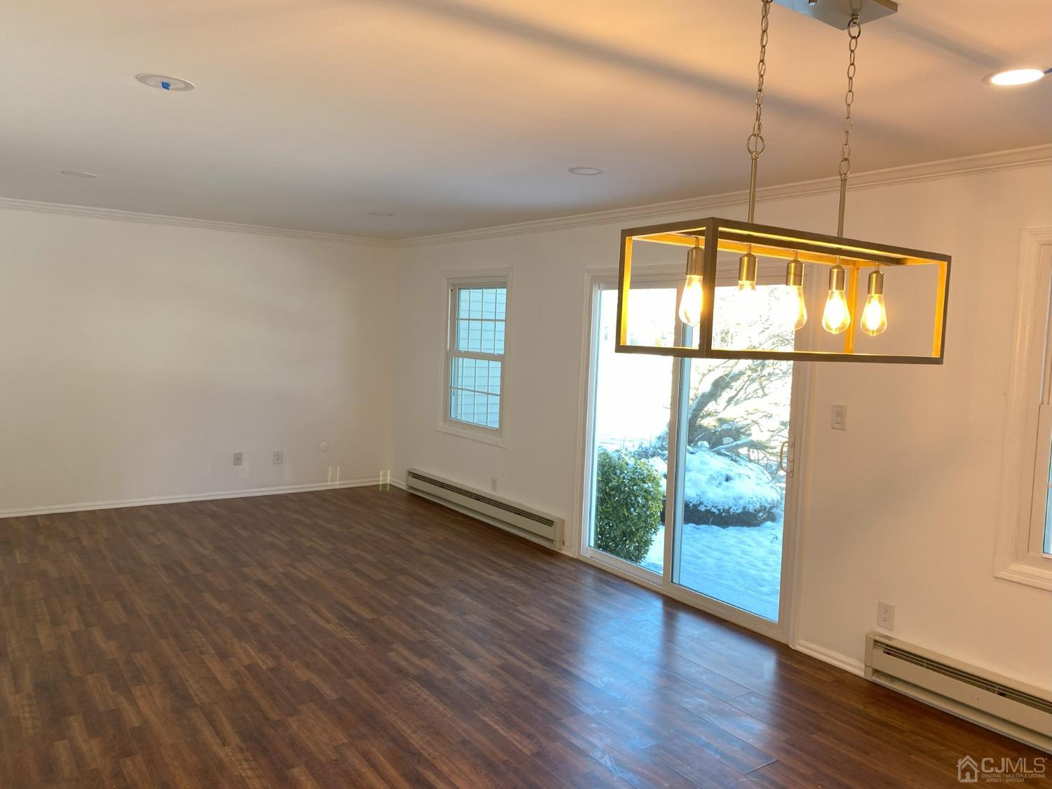 A Zacatin Road Freehold, NJ 07728 - Photo 13 of 25 an empty room with wooden floor and windows
