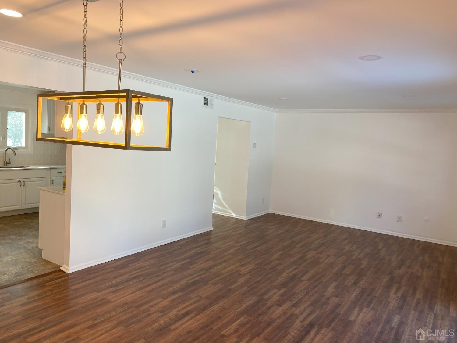 A Zacatin Road Freehold, NJ 07728 - Photo 14 of 25 an empty room with wooden floor and windows