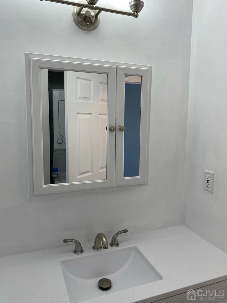 A Zacatin Road Freehold, NJ 07728 - Photo 18 of 25 a bathroom with a sink and a window