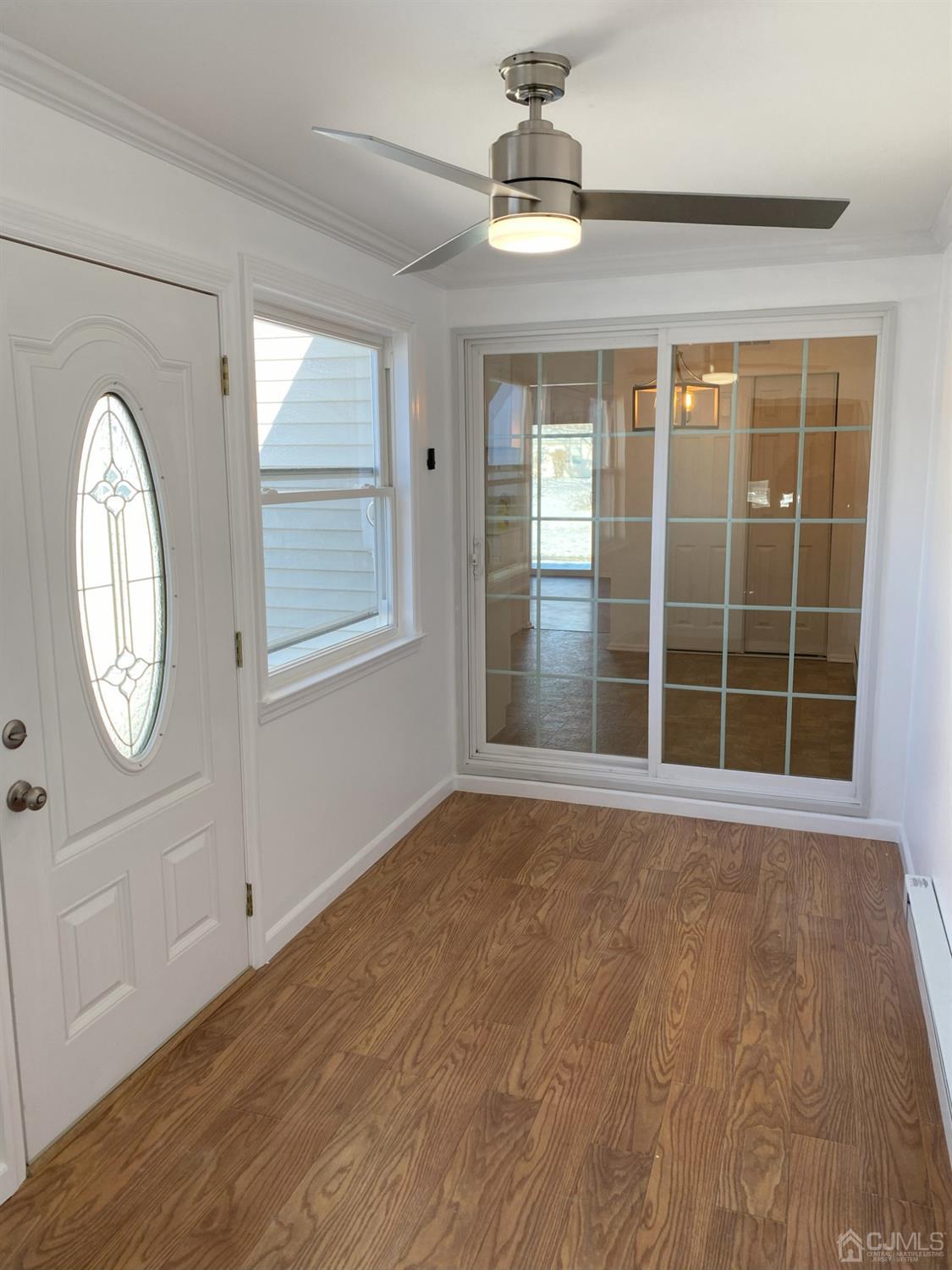 A Zacatin Road Freehold, NJ 07728 - Photo 24 of 25 a view of an empty room with a window and wooden floor