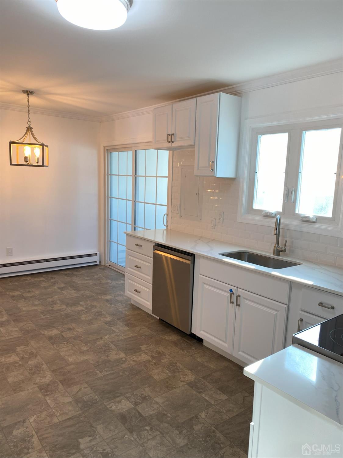 A Zacatin Road Freehold, NJ 07728 - Photo 8 of 25 a kitchen with a sink cabinets and window