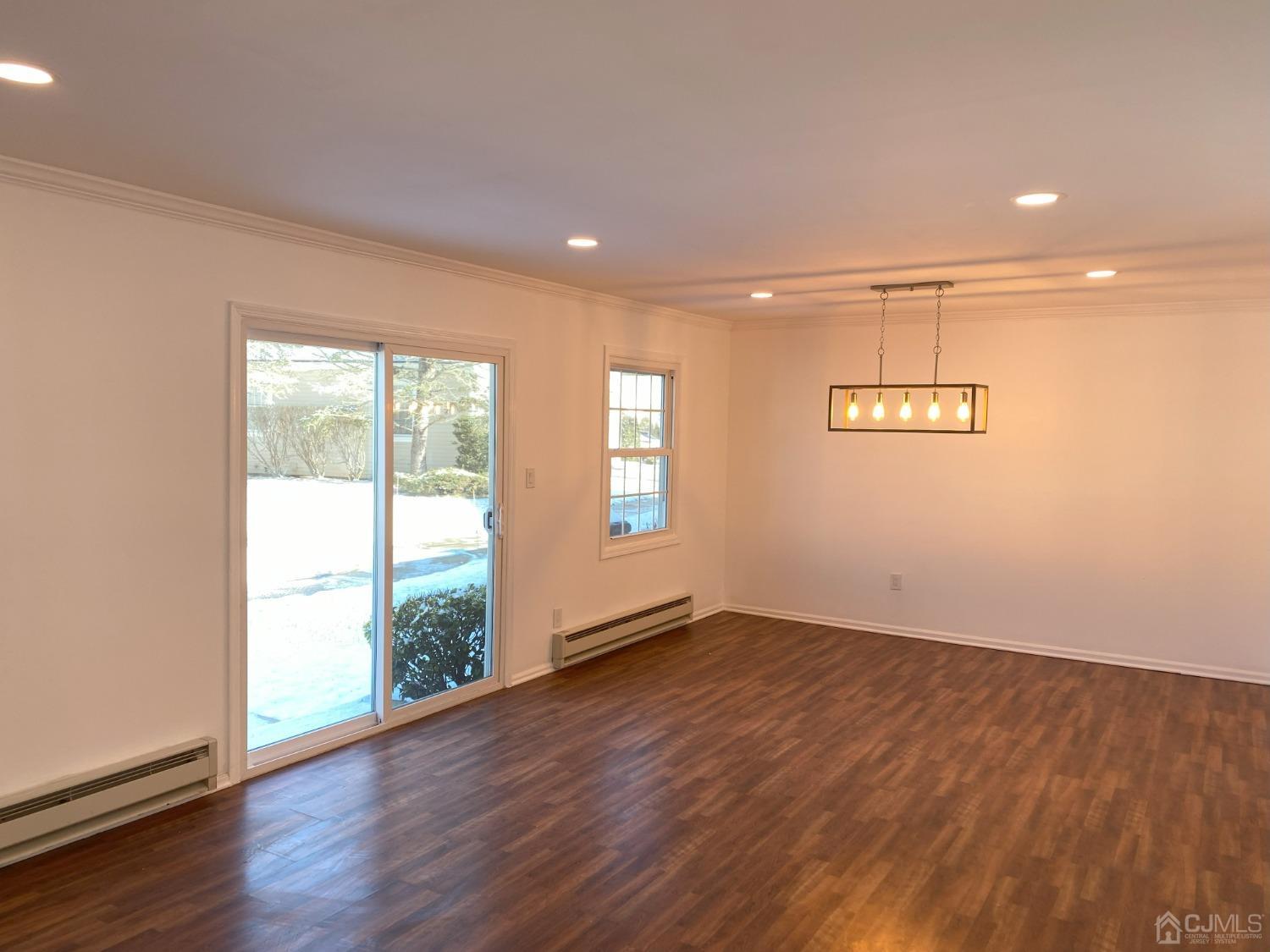 A Zacatin Road Freehold, NJ 07728 - Photo 10 of 25 an empty room with wooden floor and windows