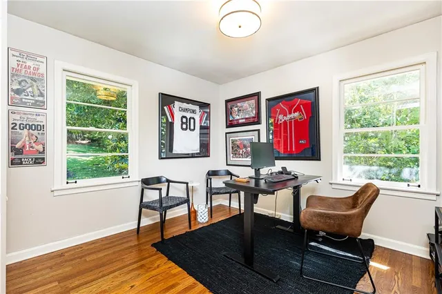 a view of a livingroom with furniture and a window