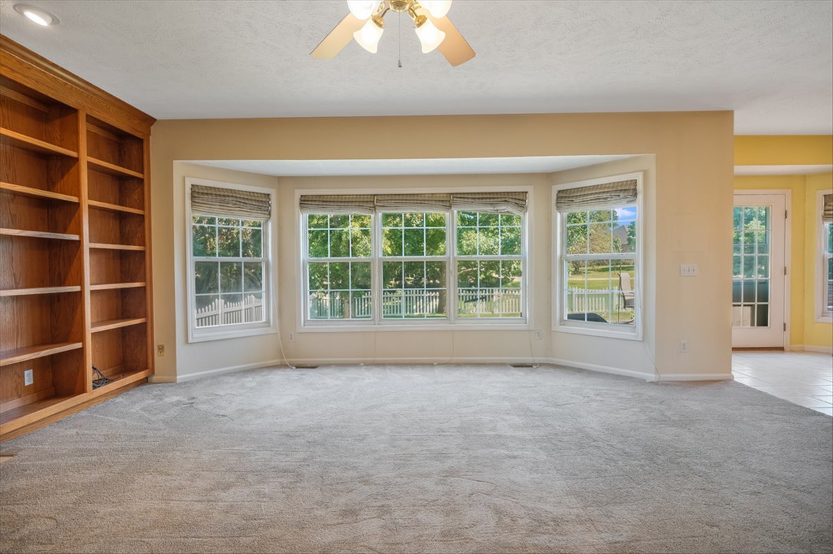 4406 Crossgate Drive Champaign, IL 61822 - Photo 13 of 64 a view of an empty room with a window and balcony view