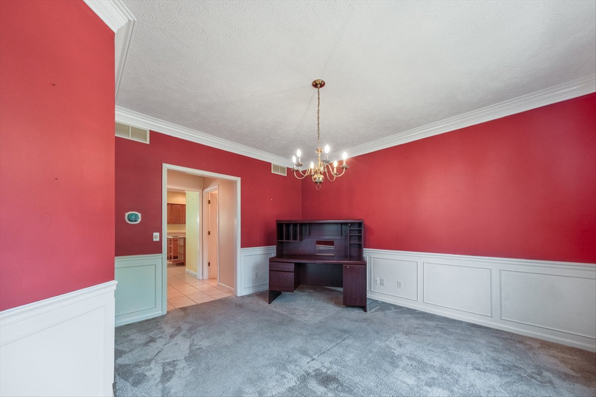 4406 Crossgate Drive Champaign, IL 61822 - Photo 22 of 64 a view of a hallway with a chandelier