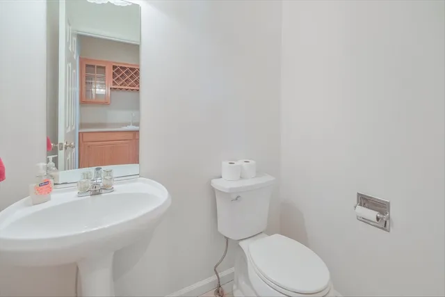 a view of a livingroom with a ceiling fan and window