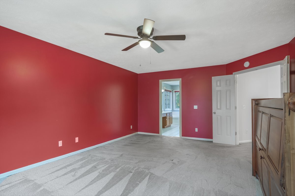 4406 Crossgate Drive Champaign, IL 61822 - Photo 33 of 64 a view of a livingroom with a ceiling fan and window
