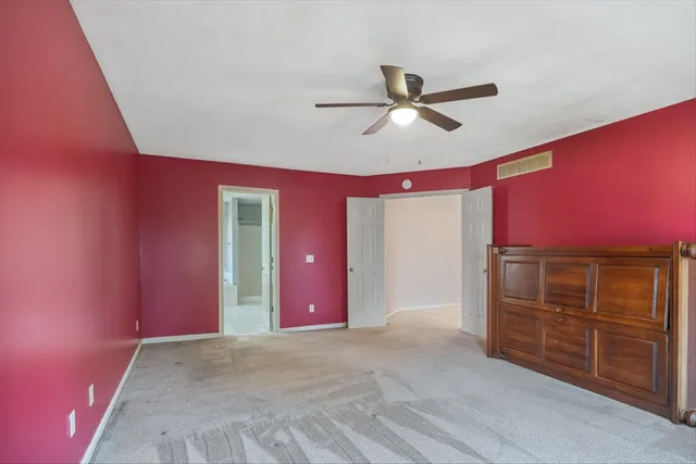 a bathroom with a double vanity sink mirror and shower