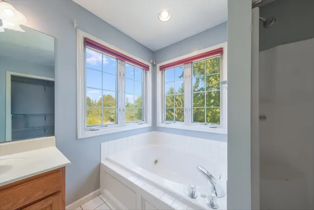 a view of an empty room with a ceiling fan