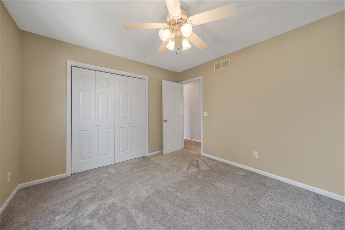 4406 Crossgate Drive Champaign, IL 61822 - Photo 41 of 64 a view of an empty room and a ceiling fan