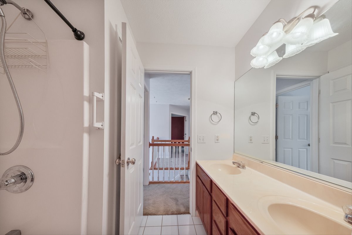 4406 Crossgate Drive Champaign, IL 61822 - Photo 44 of 64 a bathroom with a double vanity sink mirror and shower