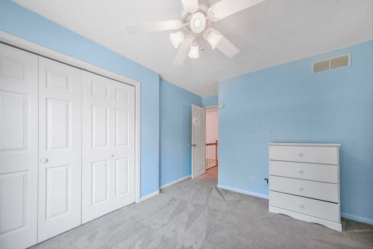 4406 Crossgate Drive Champaign, IL 61822 - Photo 46 of 64 a view of an empty room with a ceiling fan
