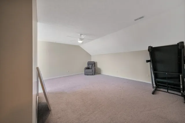 a view of a house with swimming pool and sitting area