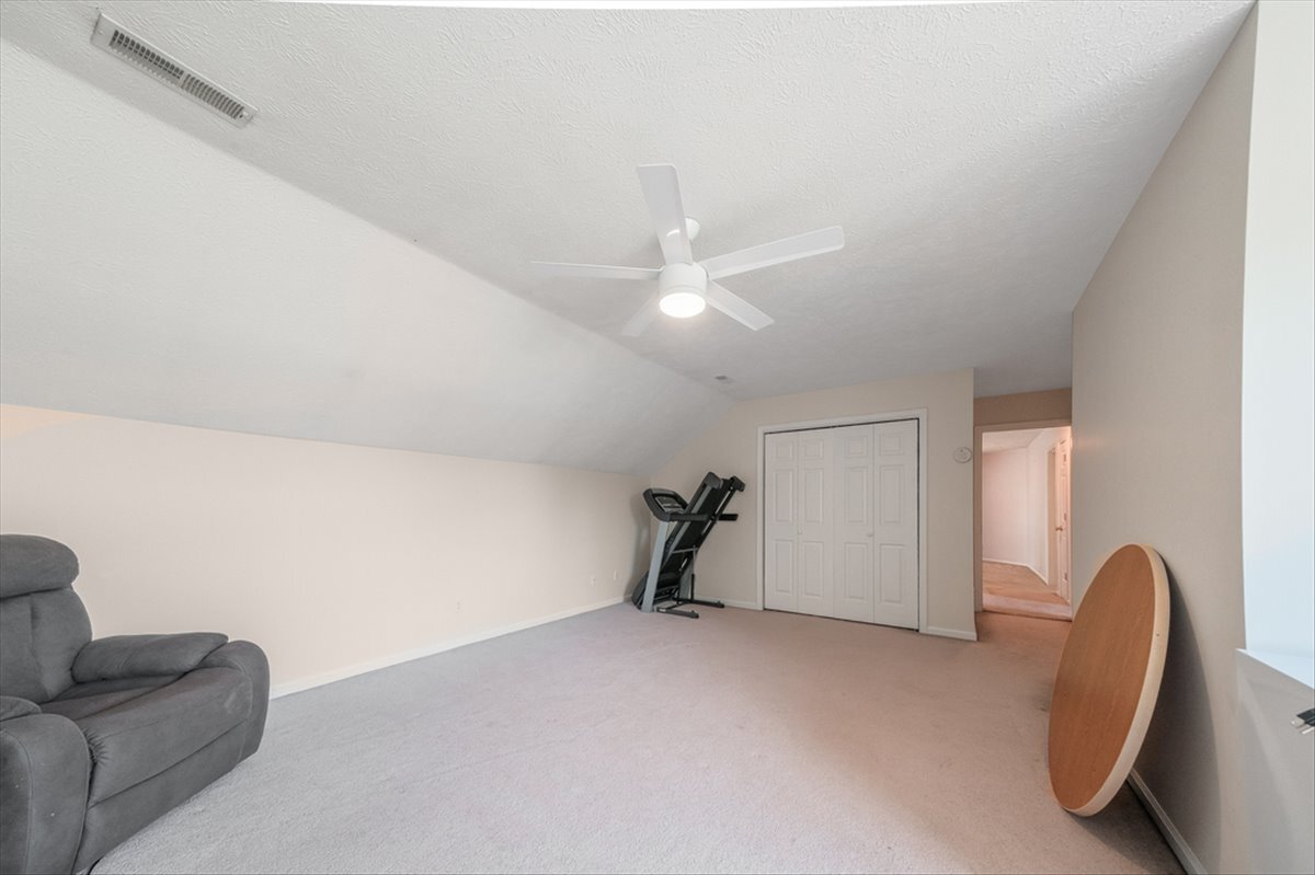 4406 Crossgate Drive Champaign, IL 61822 - Photo 50 of 64 a view of a livingroom with a ceiling fan and couch