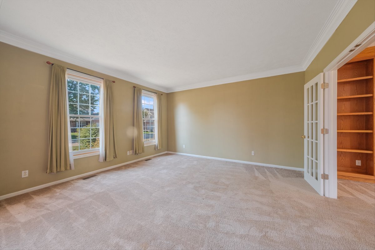 4406 Crossgate Drive Champaign, IL 61822 - Photo 6 of 64 an empty room with windows