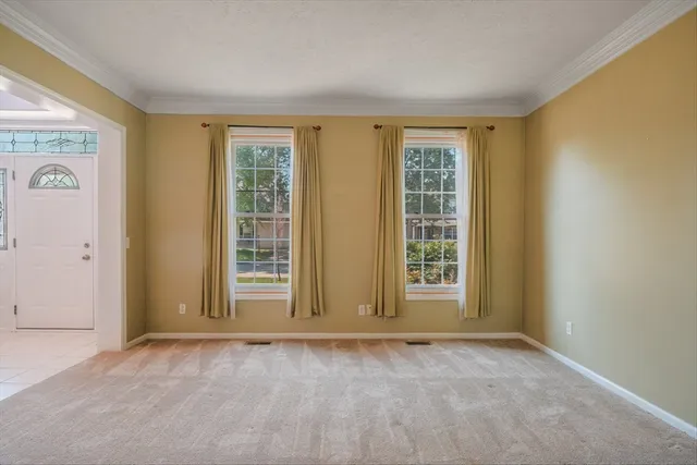a view of an empty room with a balcony