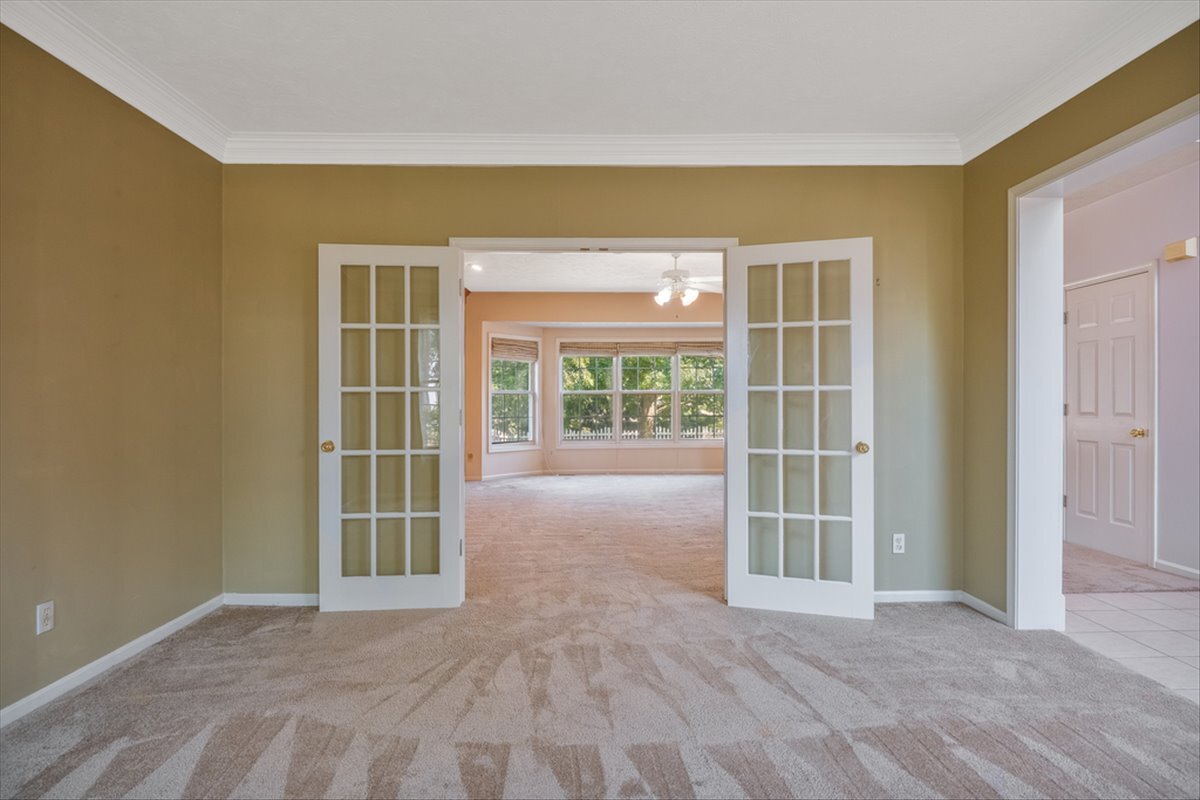 4406 Crossgate Drive Champaign, IL 61822 - Photo 10 of 64 a view of an empty room with a balcony